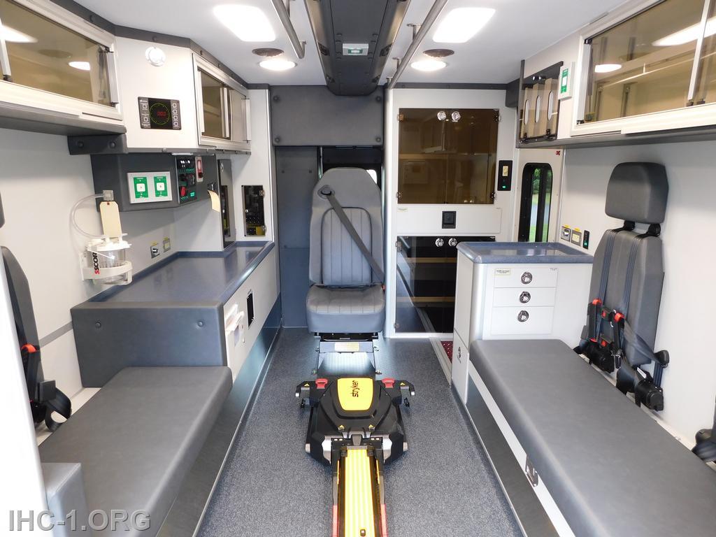 Interior patient care area looking to the front. The yellow and black device on the floor is part of the Styker Auto-Load system.